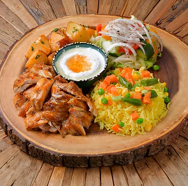 Chicken shawarma platter with rice, garlic potatoes, salad and garlic sauce