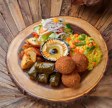Vegetarian platter with falafel, stuffed grape leaves, hummus and rice